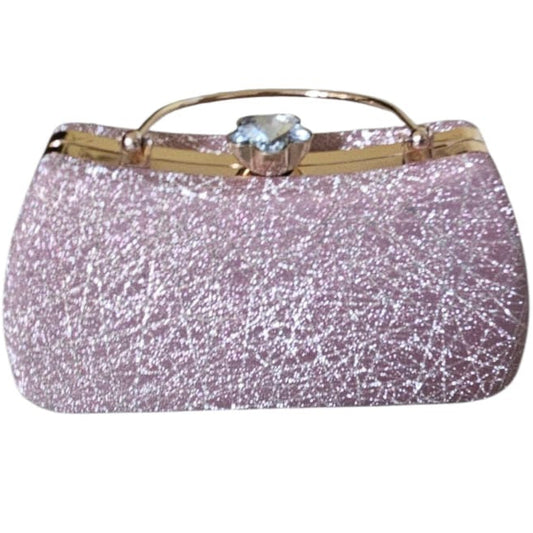 Pink glittery handbag with a gold handle on a white background
